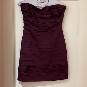 Form fitting purple pleated dress